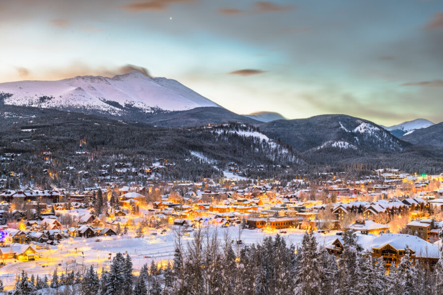 Winter town scene in Summit County, Colorado with snow-covered streets and mountain backdrop